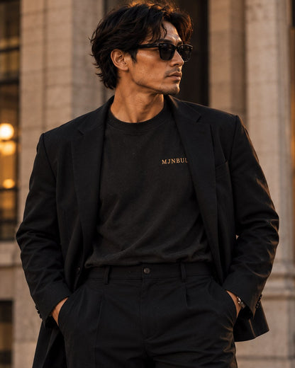 Black MJNBUU tee styled under a blazer